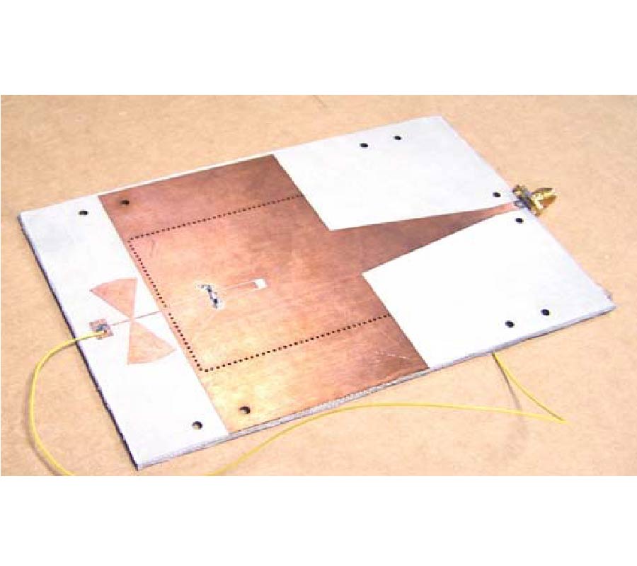 SUBSTRATE INTEGRATED WAVEGUIDE FREQUENCY-AGILE SLOT ANTENNA AND ITS MULTIBEAM APPLICATION