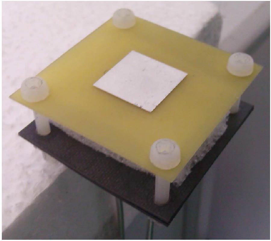 A LOW-COST L-PROBE FED DUAL-POLARIZED SLOT ANTENNA FOR C-BAND PHASED-ARRAY APPLICATIONS