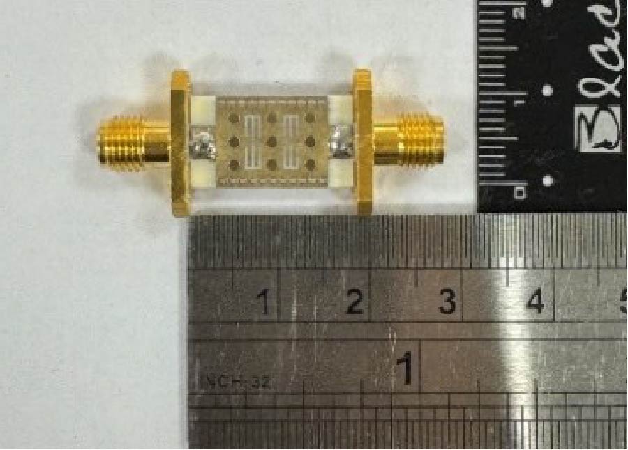 Compact Substrate-Integrated Waveguide Bandpass Filter Using Open-Circuited and Short-Circuited Vias and Slots