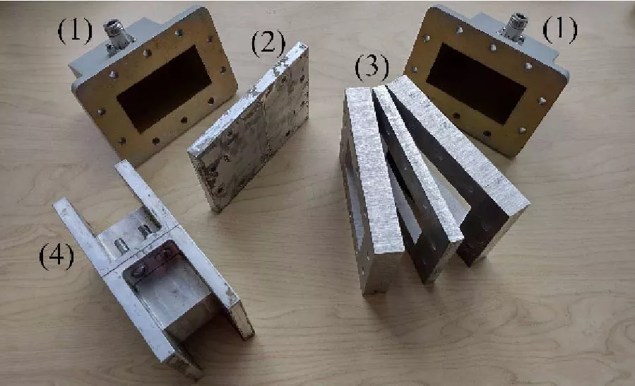 Multilayer Waveguide Bandpass Filters Based on Subwavelength CSRR and Omega Type Inclusions