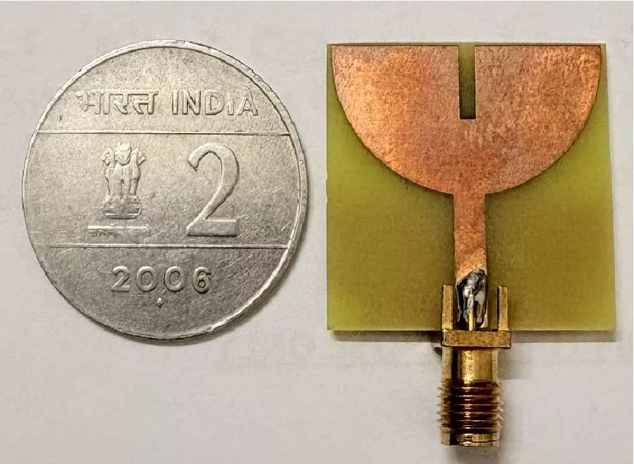 Compact Wideband Antenna Design Incorporating DGS, Slots and Tiny Reflectors for Wireless Applications