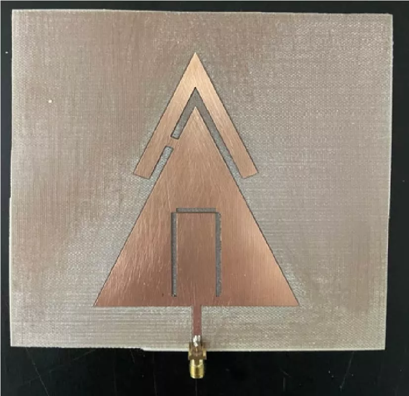 Multiband Characteristic of a Microwave Triangular Patch Antenna with Harmonic Suppression Capability