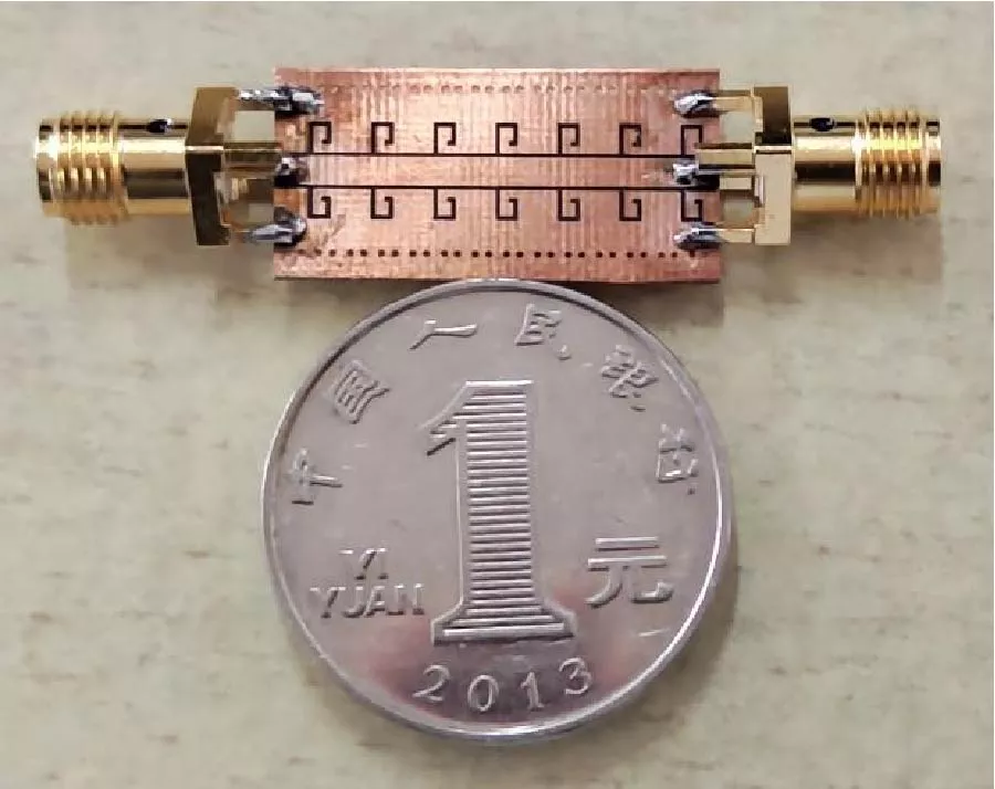 Miniaturization and Transition Sharpening of Plasmonic Filters via Interdigital Capacitors