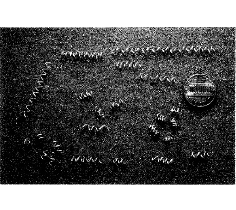 Microwave Chiral Materials: A Review of Experimental Studies and Some Results on Composites with Ferroelectric Ceramic Inclusions